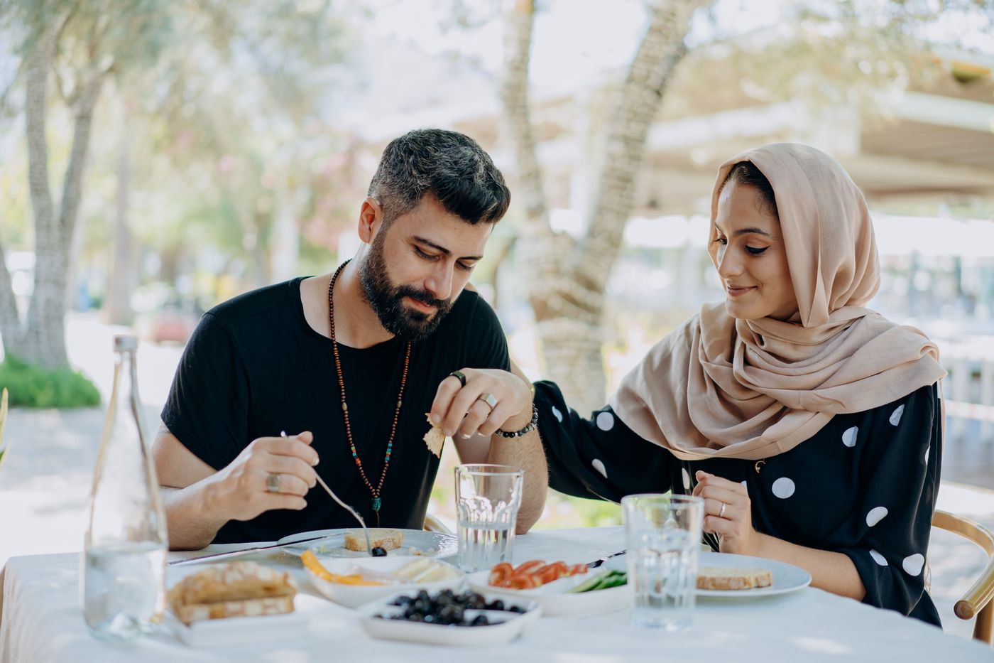 Couple sharing a meal outdoors