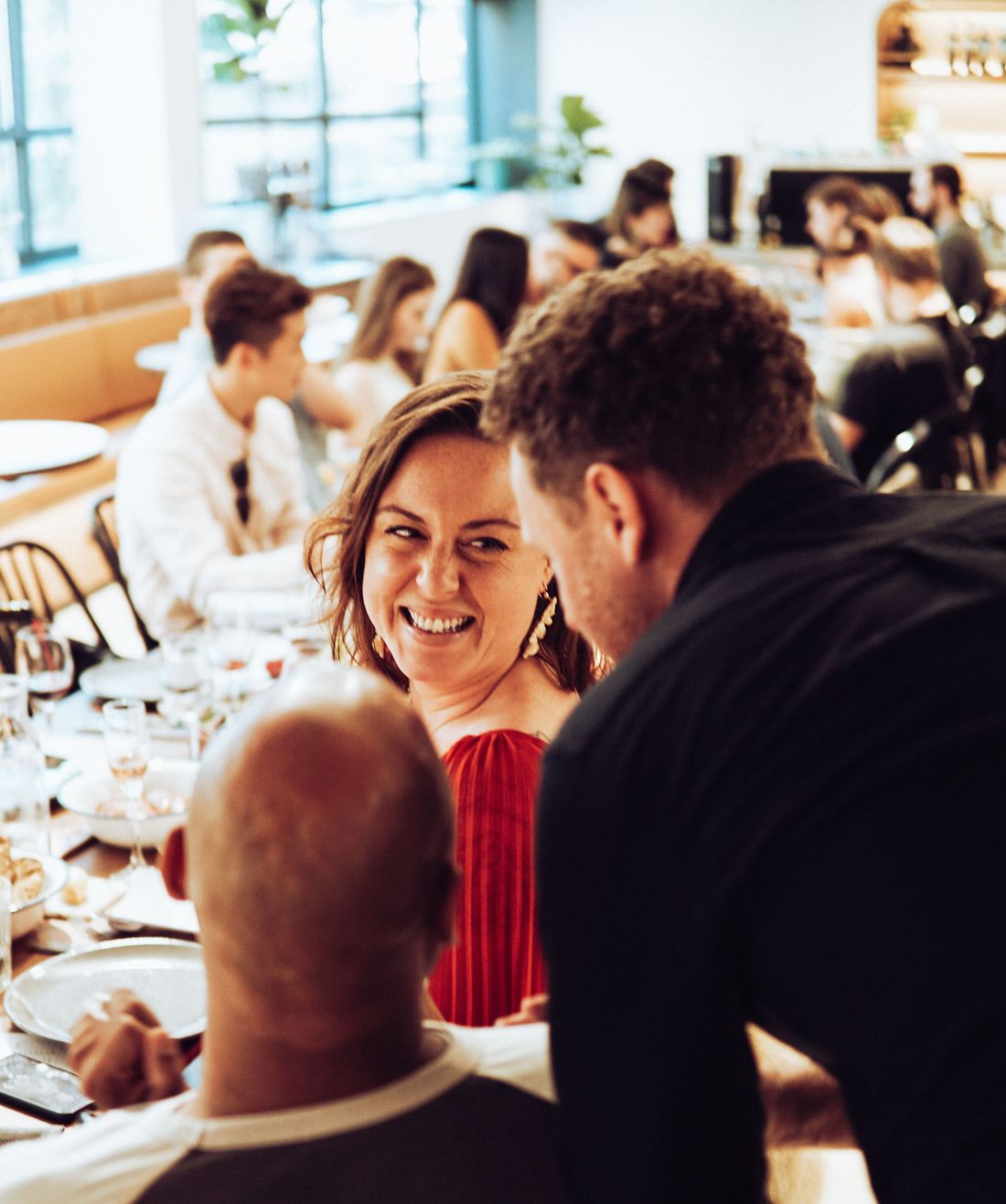 Couple laughing at dinner