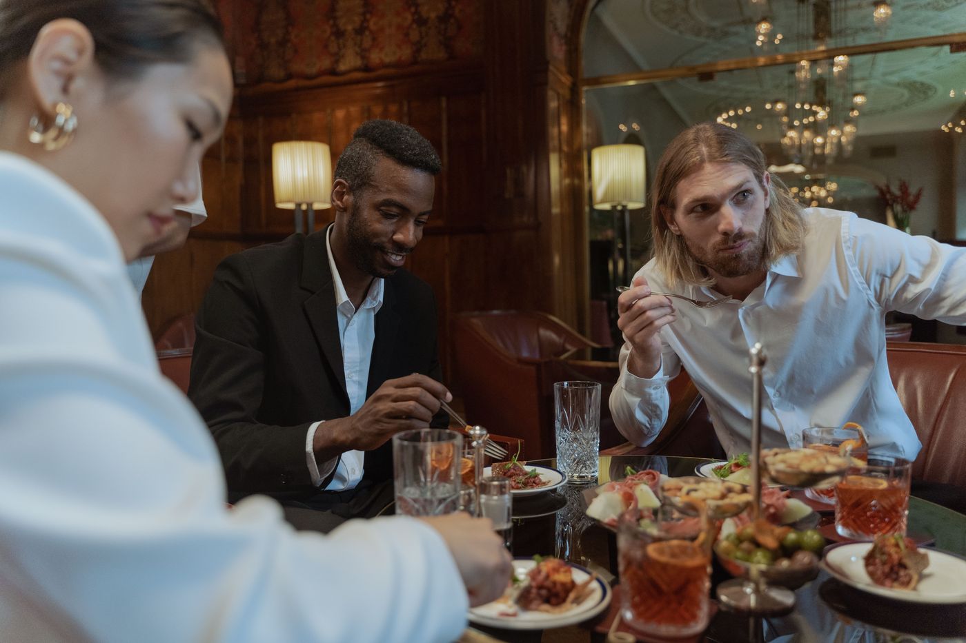 Friends and diners enjoying a meal at a restaurant